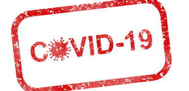 COVID-19 in roter Schrift mit roten Rahmen